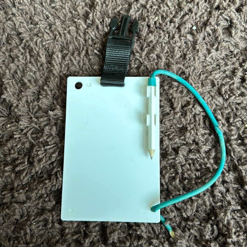 Trident Underwater Writing Slate comes with a pencil and holder.size 4x6